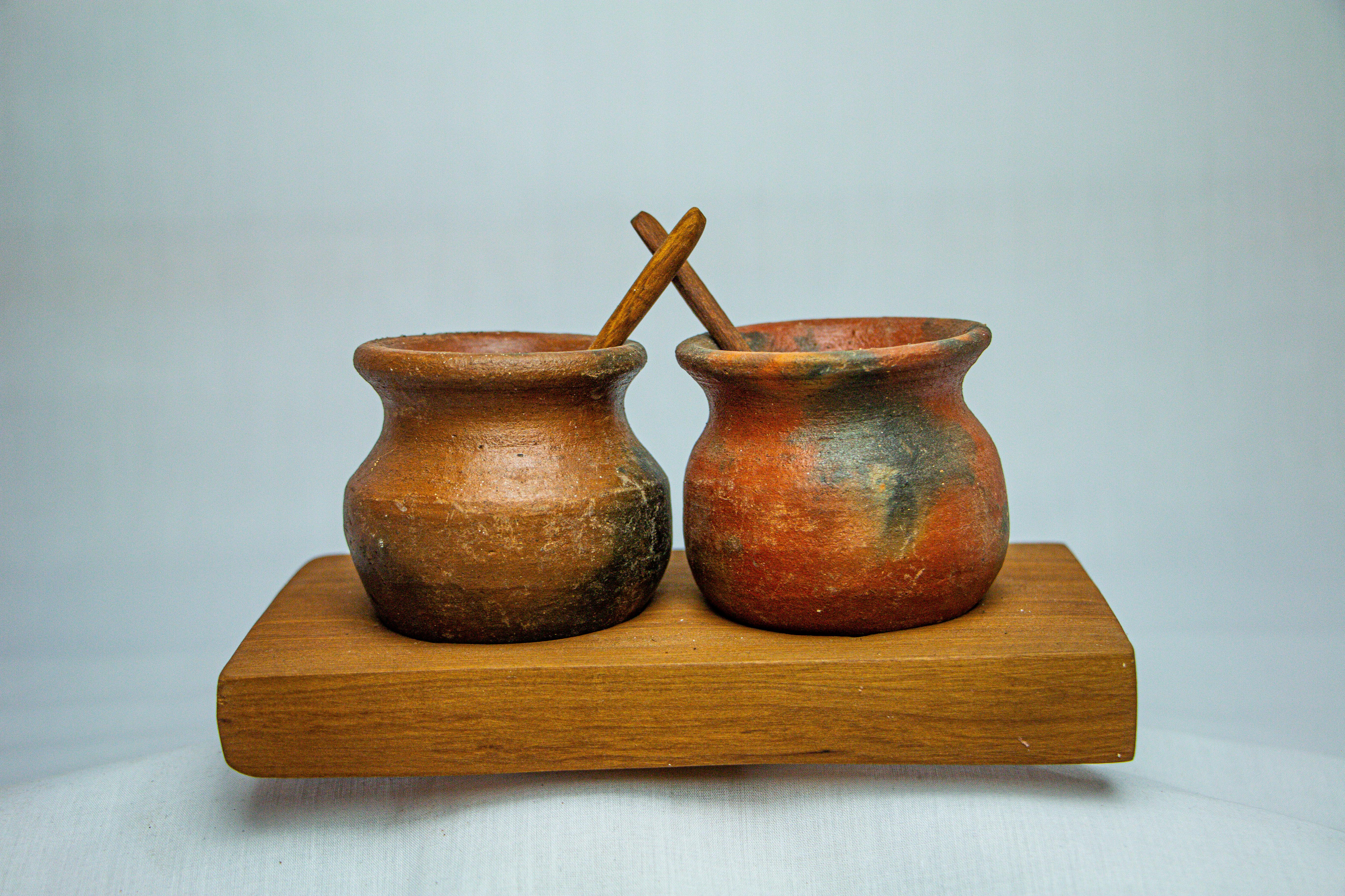 Claypot with Spoon on a Wooden Stand