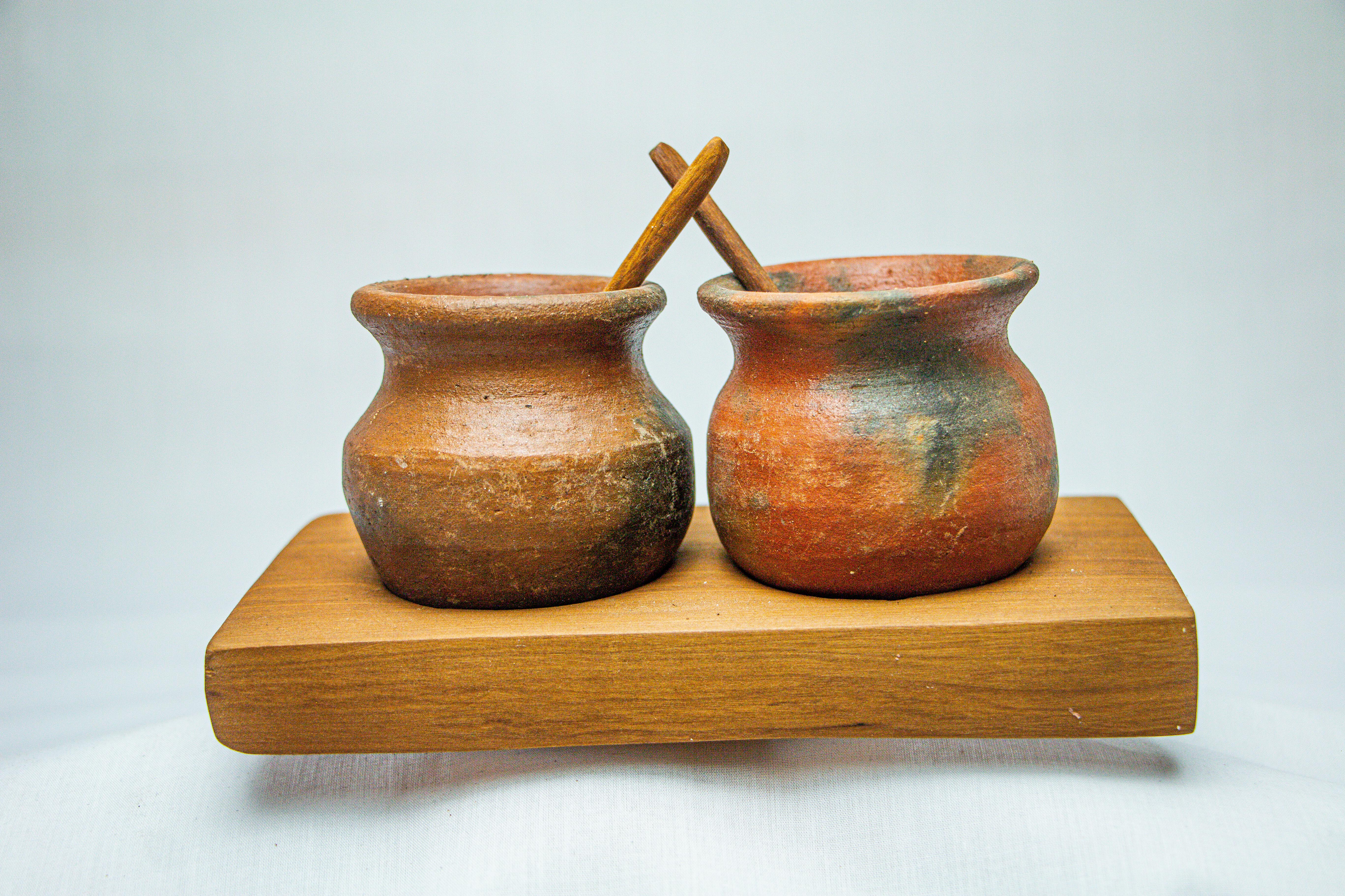 Claypot with Spoon on a Wooden Stand